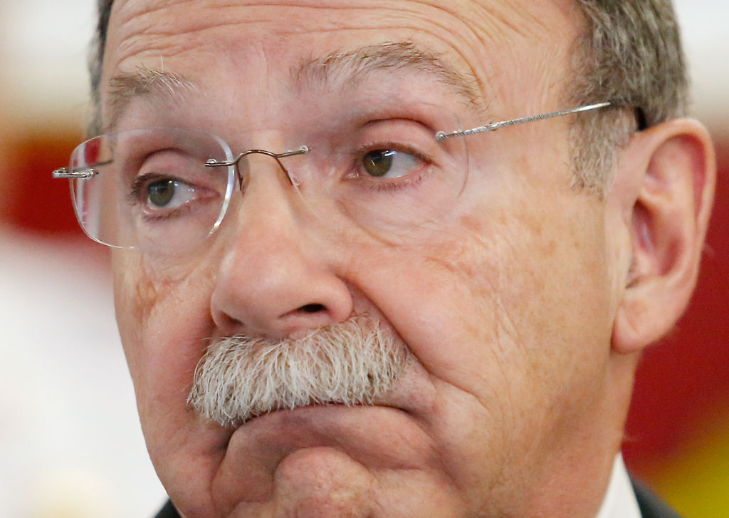 R. Bowen Loftin listens during a news conference